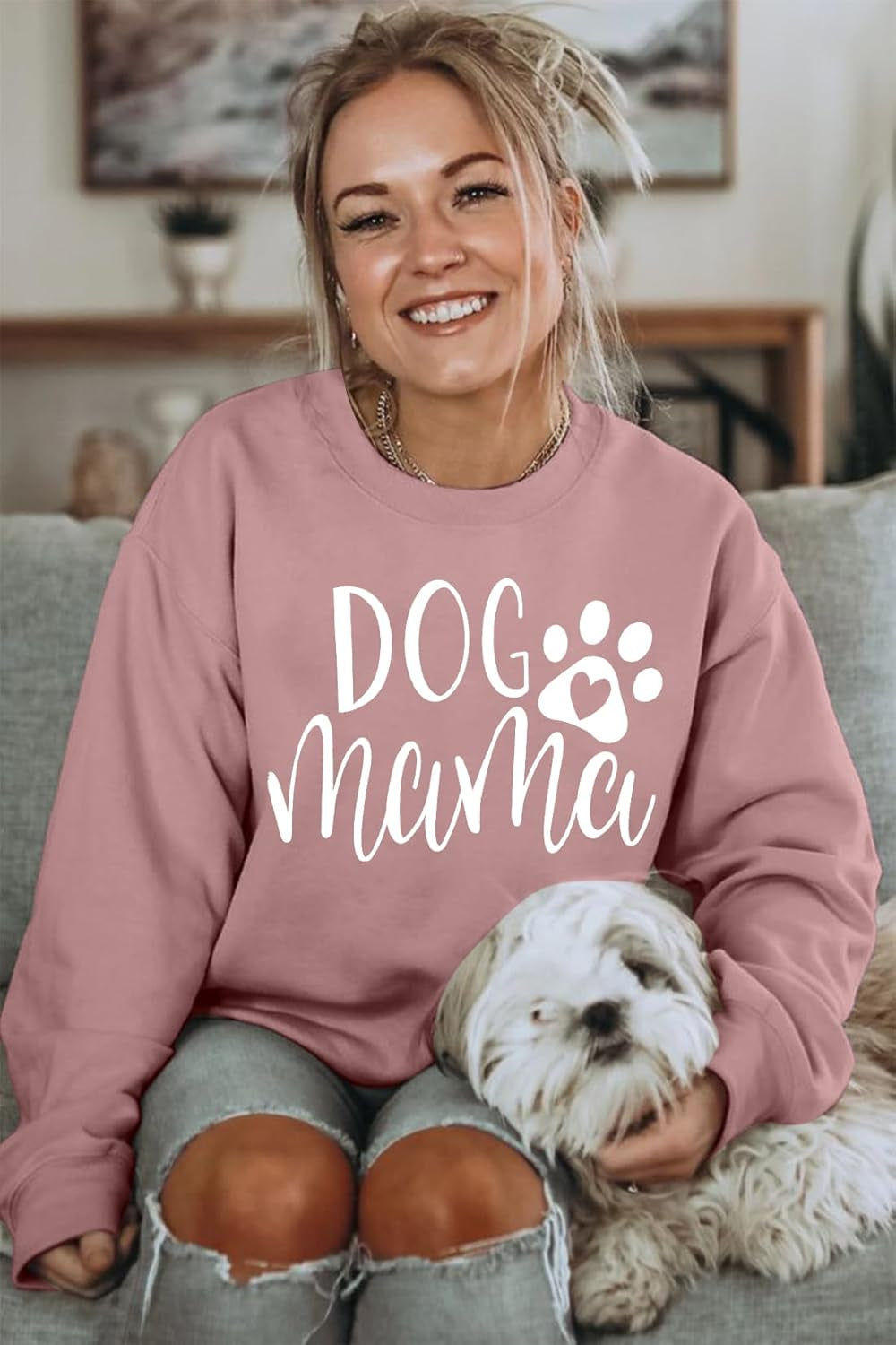 Dog mom pink sweatshirt with paw-print heart graphic, women's long-sleeve pullover.
